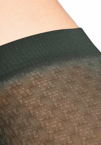 Collant opachi con una vita verde scuro e una gamba trasparente texturizzata che presenta un sottile motivo houndstooth in una tonalità di marrone tenue.