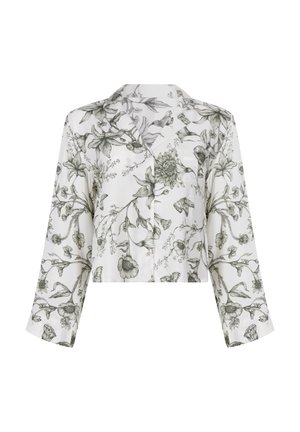 Witte cropped button-up shirt met zwart gedetailleerde bloemen- en vlinderprint, met lange mouwen en een notch kraag.