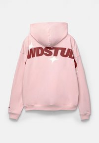 Pink hoodie with a kangaroo pocket, a large maroon "WDSTUDS" printed on the back, and white star graphics. Soft, textured fabric.