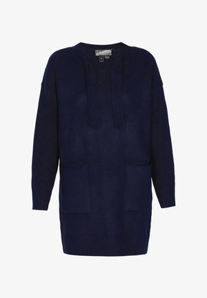 Marineblauwe oversized trui met een ronde halslijn, verticale plooien aan de voorkant en twee zijzakken; gemaakt van zachte, gestructureerde stof.