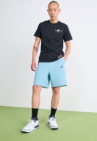 Nike Sportswear SPORTSWEAR TECH FLEECE - Calças de fato de treino - denim turq/black