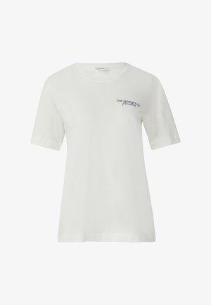 T-shirt en coton blanc à manches courtes, arborant le texte "L'ESSENCE DE la liberté" en bleu marine. Col rond simple et coupe décontractée.