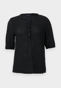 Top corto a maniche corte in maglia nera con un motivo a diamante testurizzato, scollatura a scallop e chiusura frontale con bottoni. Caratterizzato da una vestibilità comoda.