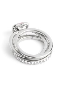 Silver multi-band ring with polished finish, featuring a heart-shaped accent and small clear gemstones along one band.