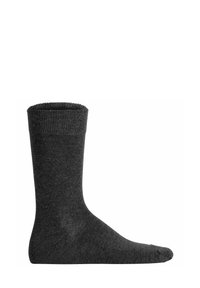Grau Socke aus einem weichen, dehnbaren Material. Verfügt über einen gerippten oberen Teil und einen glatten Körper in einer einfarbigen Ausführung, knielang.