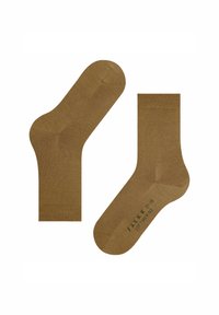 Braune Crew-Socken in Knöchelhöhe mit verstärkter Zehen- und Fersenpartie, mit der Aufschrift "FALKE SOFT MERINO 37-38" an der Sohle.