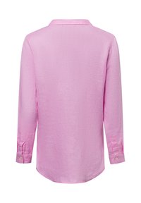 Langarmshirt in lichtroze, van textuurstof. Heeft een kraag en knoopsluiting op de mouwen, met een ronde zoom aan de onderkant.