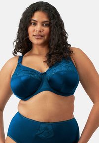 Teal satiinili bra, jossa on tuki langoilla ja koristeellista pitsi�ä. Sisältää säädettävät hihnat. Korkea vyötäröinen yhteensopiva alushousu, joka on myös teal-värinen.