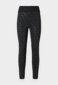 Leggings neri con un motivo a diamond quilted, una ampia vita elasticizzata e una texture liscia, adatti per abbigliamento sportivo o casual.
