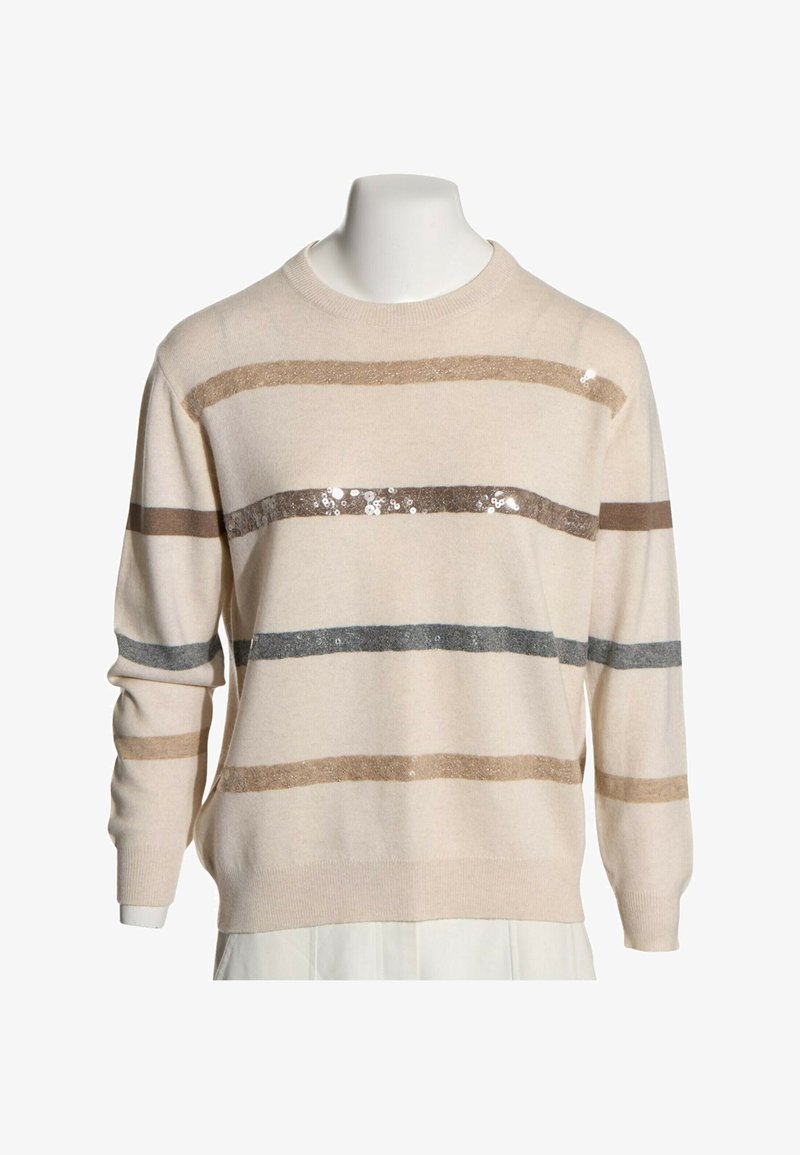 Pull couleur crème avec des rayures horizontales beige, marron et grises, certaines décorées de sequins brillants, présenté sur un buste de mannequin blanc.