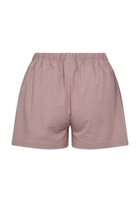 Lysrosa shorts med elastisk talje, der har en struktureret overflade og en løs pasform. Designet er enkelt og uden pynt.