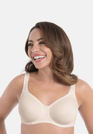 Beige beha met gestructureerde stof, gladde cups, brede bandjes en bloemrijke accenten op de bandjes. Klassiek ontwerp voor comfort en ondersteuning.