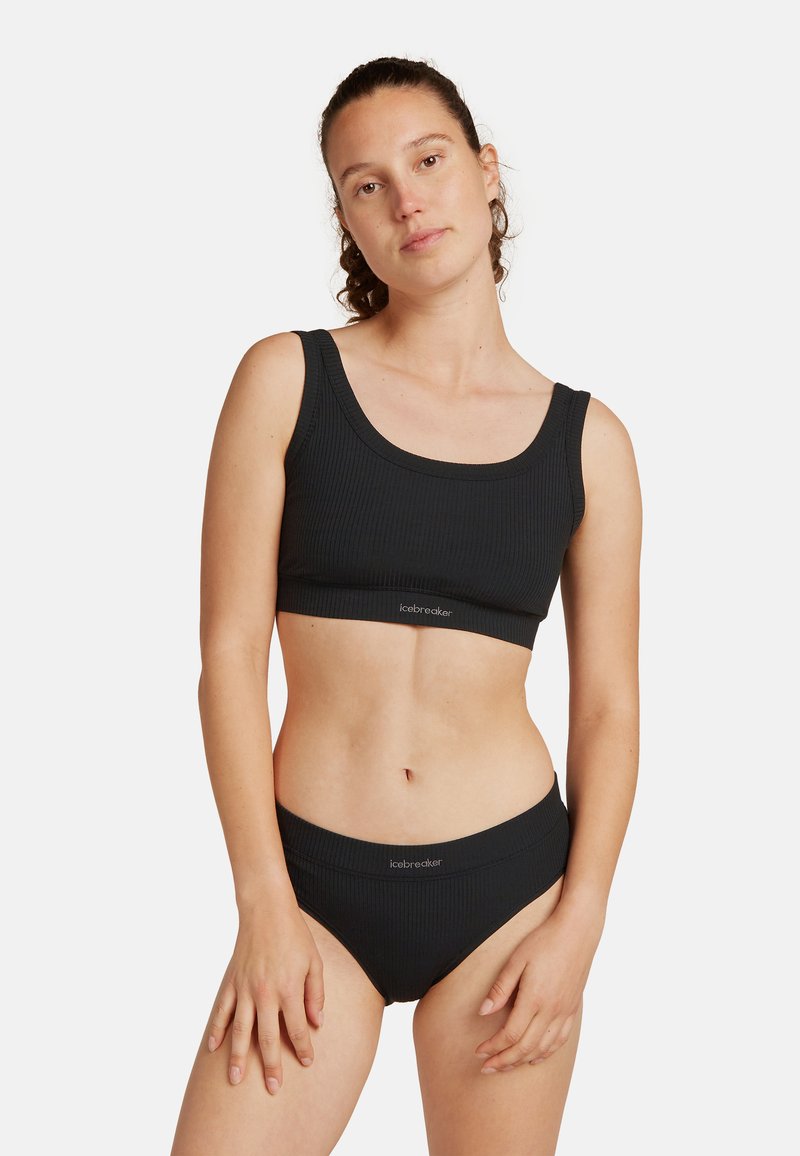 Top corto a coste nero e slip a vita alta coordinati, con un ampio elastico e design semplice, realizzati in morbido tessuto elastico.