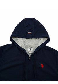 Námořnická mikina na zip s šedou podšívkou, kapuce s tkaničkou, červené logo na levé hrudi a visačka viditelná uvnitř. Hladký textilní materiál. Velikost: M.