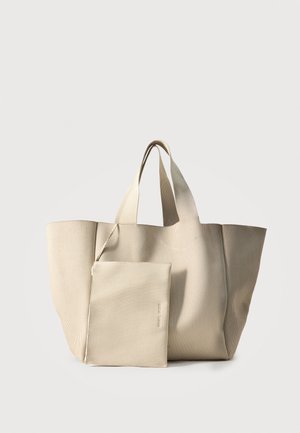 Bolsa tote de tela acanalada beige con dos asas, acompañada de una funda con cremallera a juego colocada delante.