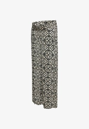 Pantaloni a gamba larga con vita alta caratterizzati da motivi geometrici e floreali in bianco e nero su tessuto beige chiaro.