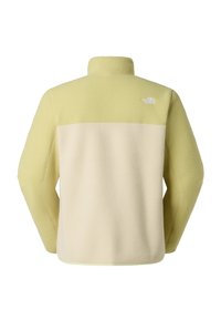 Chaqueta de forro polar en amarillo claro y crema, con cuello alto, bloques de color contrastantes y un pequeño logo blanco en la parte superior de la espalda.