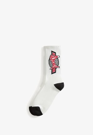 Weißer Socken mit schwarzer Spitze und Ferse, mit einem roten stilisierten Fuchs und einem karriertem Kreis-Logo auf dem gerippten oberen Bereich.