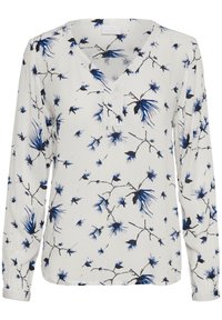 Blouse à manches longues en tissu blanc avec un motif floral bleu et noir. Design en V avec une texture subtile et un détail de bouton au col.