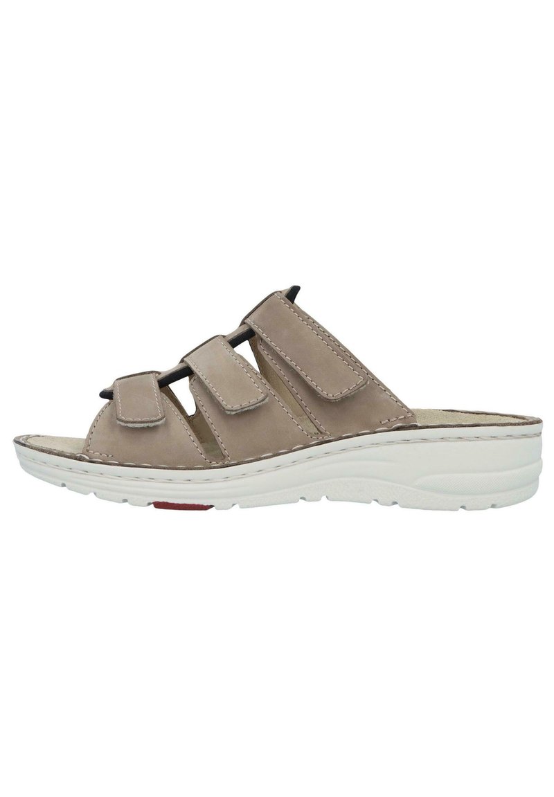 Beige leather slip-on sandal with three adjustable Velcro straps. Features a cushioned insole and a white rubber sole with slight elevation.