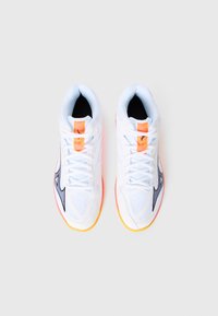 White athletic shoes with mesh panels, a black swoosh, orange accents, and a rubber sole featuring yellow and pink tones.