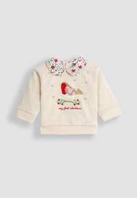 Hanorac crem, cu guler floral, având un pasăre roșie brodată, o ramură verde și textul "prima mea Crăciun" în roșu.