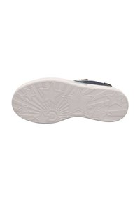 Sole di scarpa in gomma bianca con un motivo testurizzato di stelle e raggi, con una finitura liscia e una leggera curvatura nella zona delle punte.