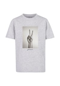 Gray cotton t-shirt featuring a black-and-white photo of a hand giving the peace sign, with the word "peace" printed below.