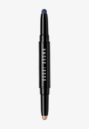 Crayon double embout dans un boîtier noir. Une extrémité présente une pointe bleue, l'autre une pointe en bronze métallique. Design lisse et cylindrique.