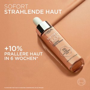 L’Oréal True Match Nude plumping tinted serum bottle on beige background with text stating 10% firmer skin in 6 weeks and hyaluronic acid content.