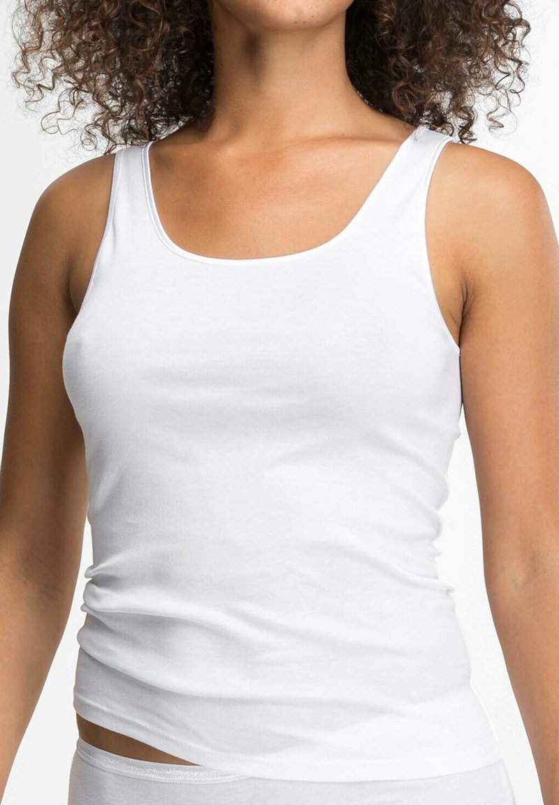 White tank top made of cotton, featuring a simple design with a rounded neckline and wide straps, smooth texture, and form-fitting shape.