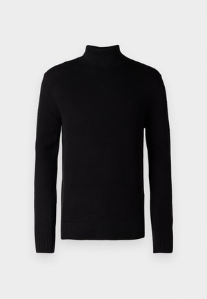 Černý rolák, žebrovaná textura, dlouhé rukávy, přiléhavý střih. Materiál vypadá jemně a elasticky. Žádné viditelné vzory nebo akcenty.