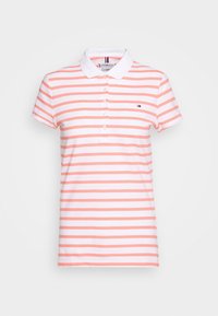 Polo tričko s krátkým rukávem v bílých a růžových pruzích. Disponuje límečkem a pěti knoflíky. Malá vyšívaná logo na hrudi.