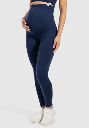 Leggings maternità navy con vita alta, realizzati in tessuto elasticizzato, offrono una texture liscia e una silhouette aderente.