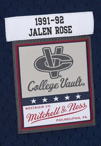 Navy fabric patch featuring "1991-92 JALEN ROSE" label. Logo in gray, red, and white accents with stars. "College Vault" in decorative font.
