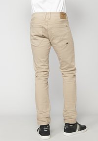 Koroshi STRETCH - Džíny Straight Fit - beige