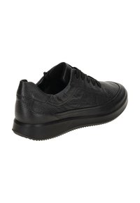 Black leather sneaker with a textured finish, rounded toe, and lace-up design. Features a thick rubber sole with a treaded pattern.