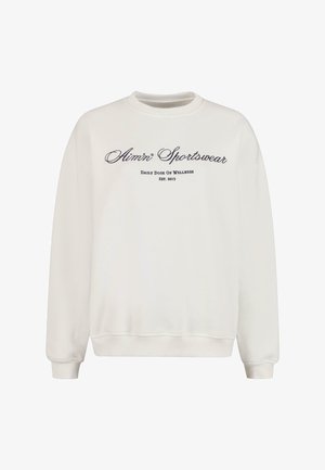 Biely mikina so žebrovanými manžetami a spodným okrajom. Obsahuje vyšívané nápisy "Alimn Sportswear" a "Daily Dose of Wellness" v tmavofialovej farbe. Mäkká textúra.