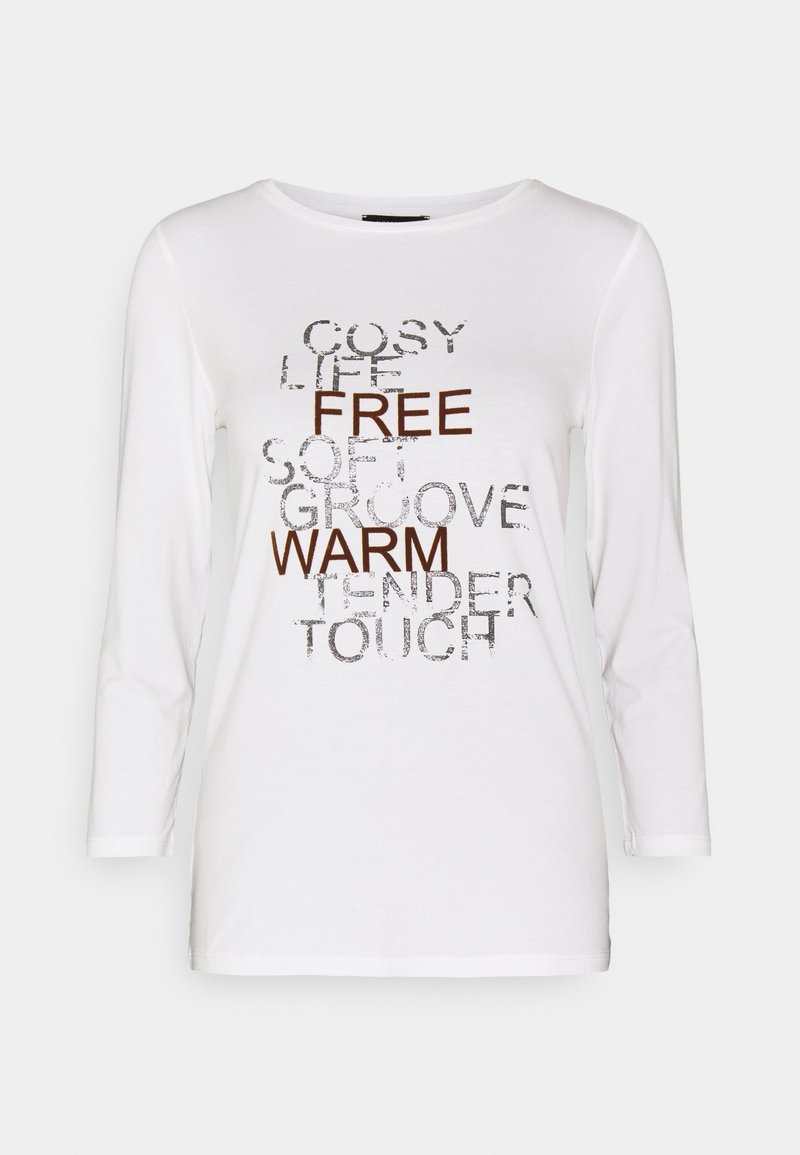 White long-sleeve shirt made of soft fabric, featuring various words in metallic silver and brown fonts, with a rounded neckline and relaxed fit.