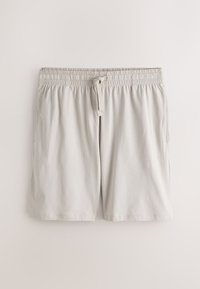 Shorts gris clair à cordon, taille élastique, poches latérales et coupe ample, affichés sur un fond blanc uni.