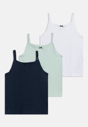 Three cotton camisoles in navy blue, light mint green, and white, each with thin straps and small black bow at the neckline.