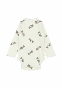 Langærmet bodystocking i bomuld i hvid med en ribbet tekstur, der har et gentaget mønster af kaniner i bløde brune nuancer. Flosset kant ved ærmerne.