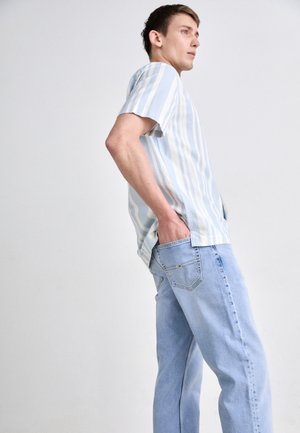 Tommy Jeans RYAN WHISKERED SLIM STRAIGHT LEG JEANS - Slim fit jeans - denim light