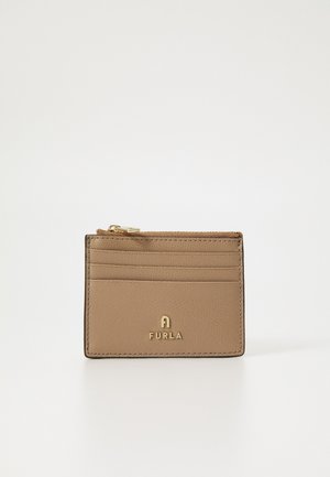 Tan leather cardholder with a zipper, featuring multiple card slots, gold hardware, and embossed logo at the front. Textured surface detail.