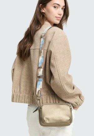 Gold metallic crossbody bag with textured finish, featuring a patterned strap in blue and neutral tones, and silver hardware accents.