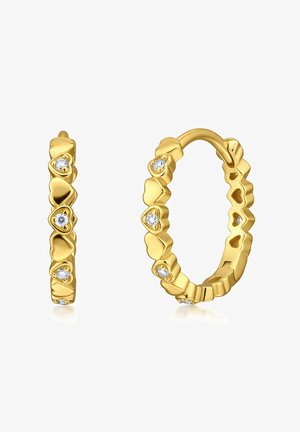 Boucles d'oreilles en or en forme de créoles ornées de cœurs solides et sertis de diamants, alternant sur un fond blanc.