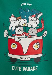 Red car with white accents, four cartoon cats wearing hats and scarves; green background with "JOIN THE CUTE PARADE" text and tree.