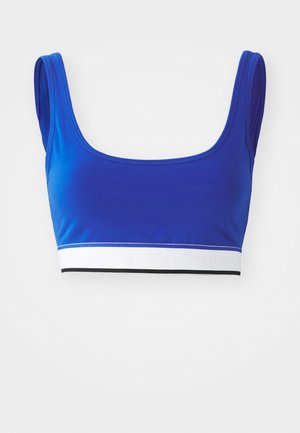 Blue crop top made of smooth fabric, featuring a wide white band with black accents and the brand name embossed in light gray.