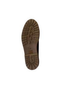 Suola nera di scarpa con pattern in gomma testurizzata, caratterizzata da una serie di sezioni rialzate e un piccolo dettaglio del logo al centro.