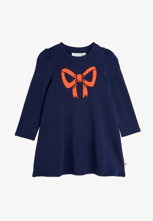 Navy dress with long sleeves and a round neckline. Features an orange bow graphic at the center. Made of soft cotton material.